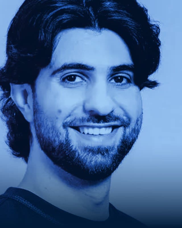 Portrait of the creator SypherPK, in CLICK's dark blue duotone treatment.